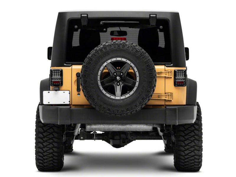 Raxiom J141596 - RAXJ141596 - Raxiom 07-18 Jeep Wrangler JK Axial Series Lux LED Tail Lights- Black Housing (Clear Lens) - Shipped in Europe - Tuningsupply.com