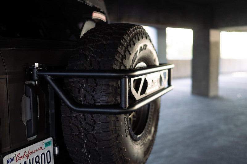 DV8 Offroad - DVETCBR-01 - DV8 Offroad 21-23 Ford Bronco Spare Tire Guard & Accessory Mount - Shipped in Europe - Tuningsupply.com