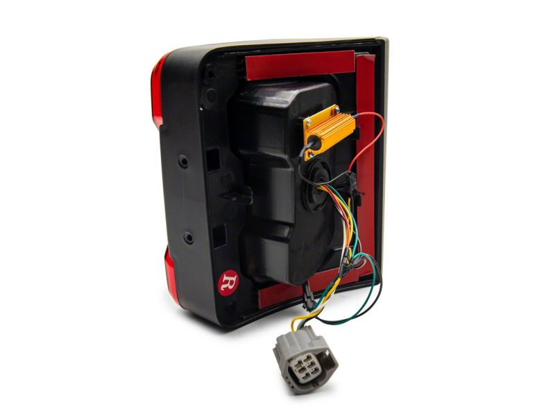 Raxiom J164242 - RAXJ164242 - Raxiom 07-18 Jeep Wrangler JK Axial Series JL Style LED Tail Lights- Black Housing- Red Lens - Shipped in Europe - Tuningsupply.com