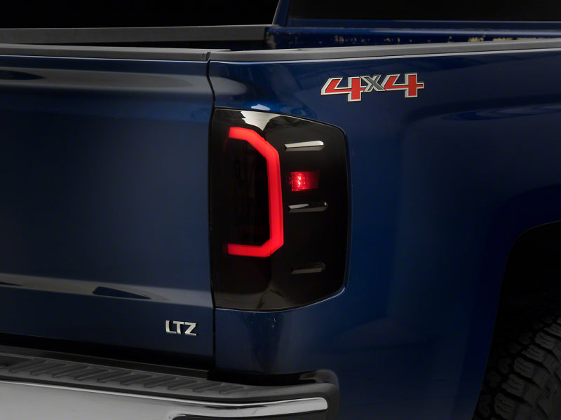 Raxiom S151298 - RAXS151298 - Raxiom 14-18 Chevrolet Silverado 1500 Axial Series LED Tail Lights- Black Housing (Smoked Lens) - Shipped in Europe - Tuningsupply.com
