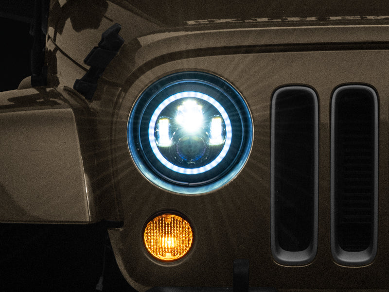 Raxiom J142665 - RAXJ142665 - Raxiom 97-18 Jeep Wrangler TJ/JK Axial 7-Inch LED Headlights w/RGB Halo- Black Housing (Clear Lens) - Shipped in Europe - Tuningsupply.com