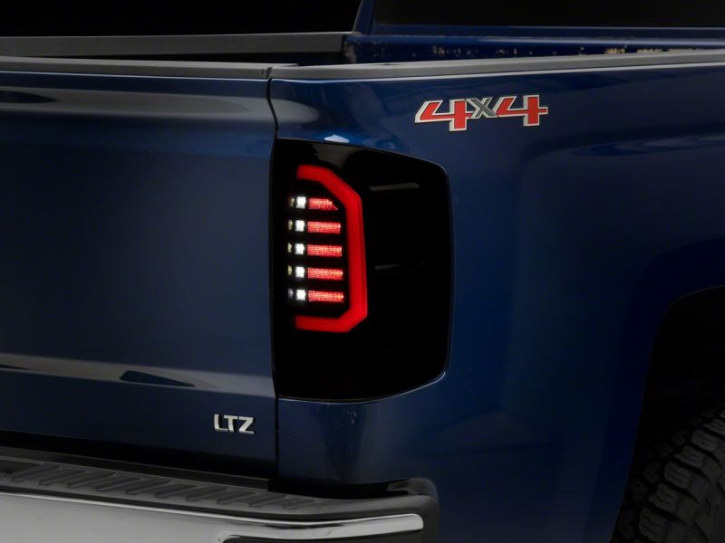 Raxiom S151298 - RAXS151298 - Raxiom 14-18 Chevrolet Silverado 1500 Axial Series LED Tail Lights- Black Housing (Smoked Lens) - Shipped in Europe - Tuningsupply.com