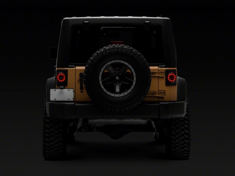 Raxiom J164240 - RAXJ164240 - Raxiom 07-18 Jeep Wrangler JK Axial Series Halo LED Tail Lights- Black Housing (Clear Lens) - Shipped in Europe - Tuningsupply.com