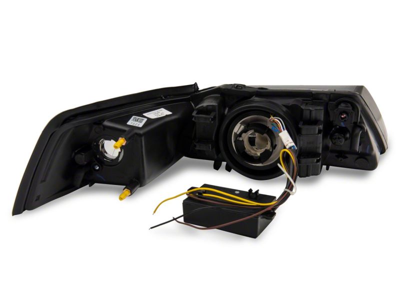 Raxiom 422713 - RAX422713 - Raxiom 99-04 Ford Mustang Axial Series Headlights w/ Sequential LED Bar- Black Housing (Clear Lens) - Shipped in Europe - Tuningsupply.com
