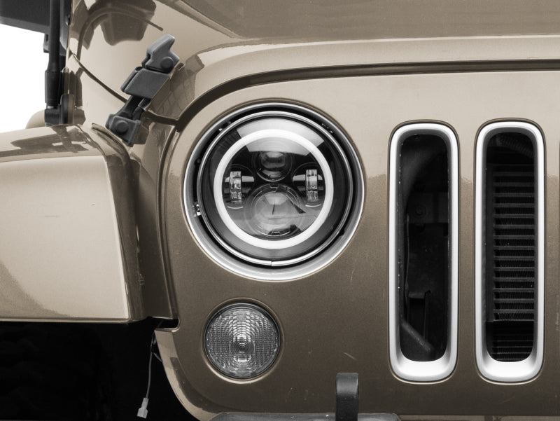 Raxiom J142665 - RAXJ142665 - Raxiom 97-18 Jeep Wrangler TJ/JK Axial 7-Inch LED Headlights w/RGB Halo- Black Housing (Clear Lens) - Shipped in Europe - Tuningsupply.com