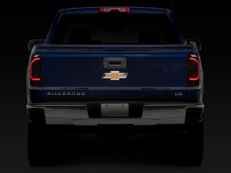 Raxiom S151298 - RAXS151298 - Raxiom 14-18 Chevrolet Silverado 1500 Axial Series LED Tail Lights- Black Housing (Smoked Lens) - Shipped in Europe - Tuningsupply.com