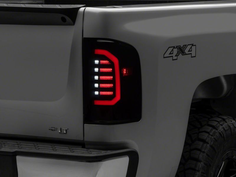 Raxiom S150366 - RAXS150366 - Raxiom 07-14 Chevrolet Silverado 1500 Axial Series LED Tail Lights- Black Housing (Smoked Lens) - Shipped in Europe - Tuningsupply.com