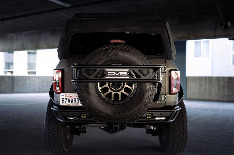 DV8 Offroad - DVETCBR-01 - DV8 Offroad 21-23 Ford Bronco Spare Tire Guard & Accessory Mount - Shipped in Europe - Tuningsupply.com