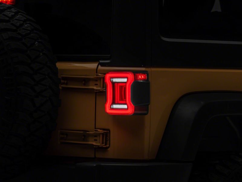 Raxiom J164242 - RAXJ164242 - Raxiom 07-18 Jeep Wrangler JK Axial Series JL Style LED Tail Lights- Black Housing- Red Lens - Shipped in Europe - Tuningsupply.com