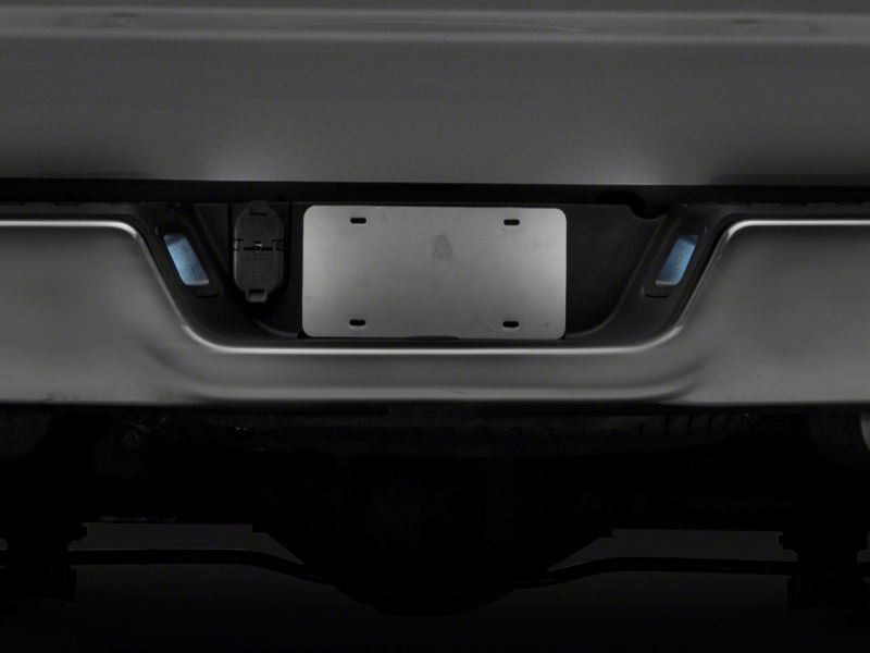 Raxiom R117120 - RAXR117120 - Raxiom 13-18 Dodge RAM 1500 Axial Series LED License Plate Lamps- Smoked - Shipped in Europe - Tuningsupply.com