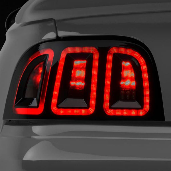 Raxiom 389876 - RAX389876 - Raxiom 96-98 Ford Mustang Icon LED Tail Lights- Black Housing (Smoked Lens) - Shipped in Europe - Tuningsupply.com