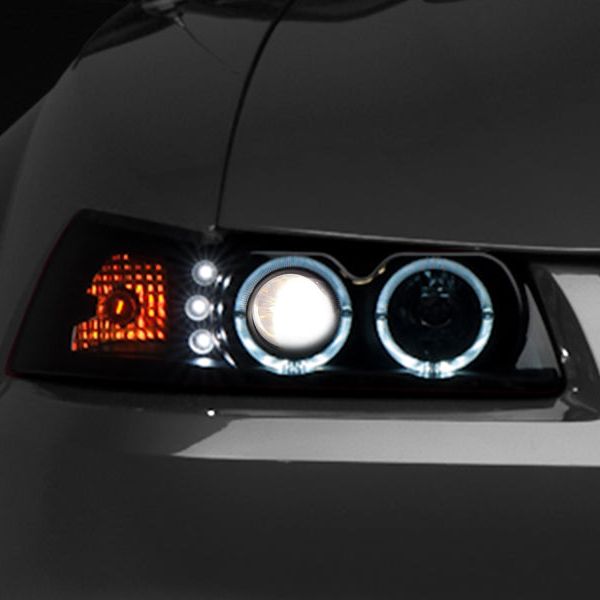 Raxiom 49113 - RAX49113 - Raxiom 99-04 Ford Mustang Dual LED Halo Projector Headlights- Black Housing (Smoked Lens) - Shipped in Europe - Tuningsupply.com