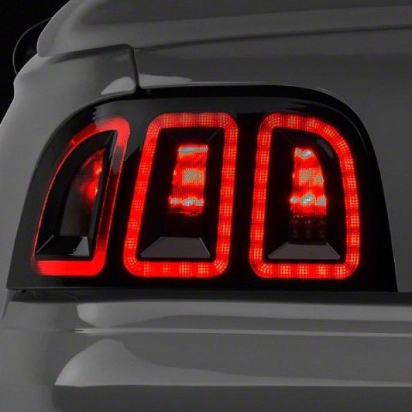 Raxiom 389876 - RAX389876 - Raxiom 96-98 Ford Mustang Icon LED Tail Lights- Black Housing (Smoked Lens) - Shipped in Europe - Tuningsupply.com