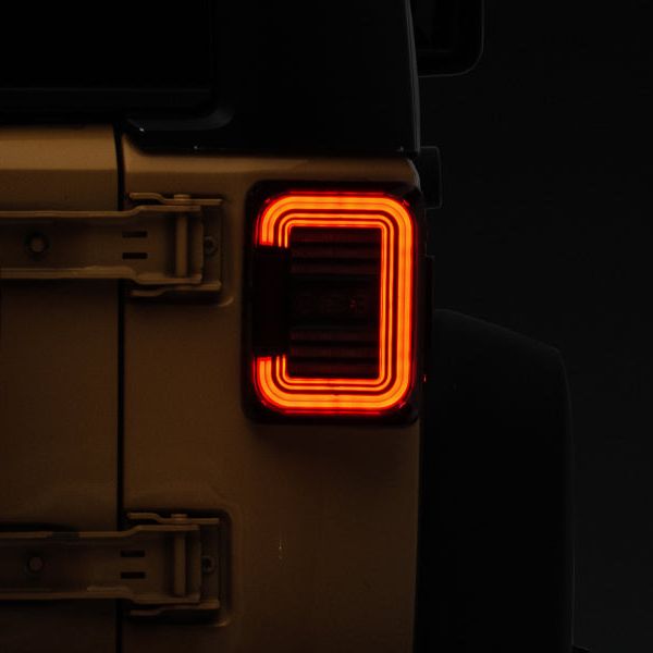 Raxiom J138358 - RAXJ138358 - Raxiom 07-18 Jeep Wrangler JK Axial Series LED Halo Tail Lights- Black Housing (Dark Smoked Lens) - Shipped in Europe - Tuningsupply.com