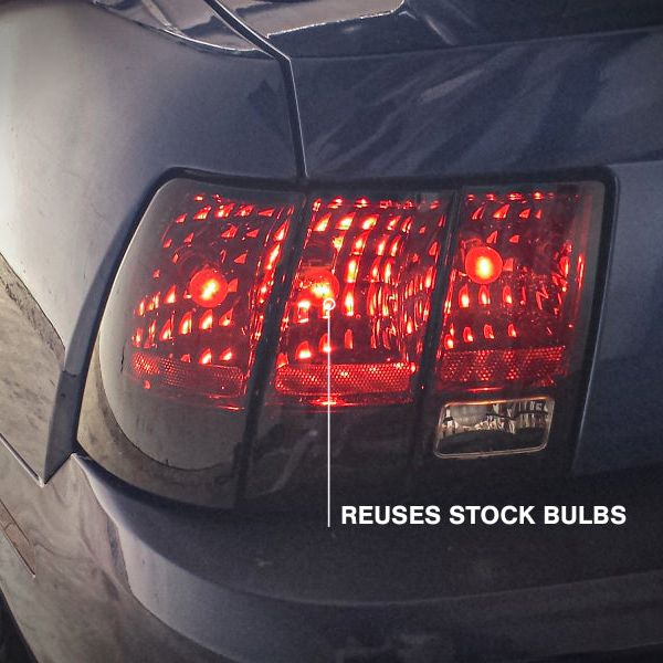 Raxiom 49080 - RAX49080 - Raxiom 99-04 Ford Mustang Excluding 99-01 Cobra Tail Lights- Black Housing (Smoked Lens) - Shipped in Europe - Tuningsupply.com