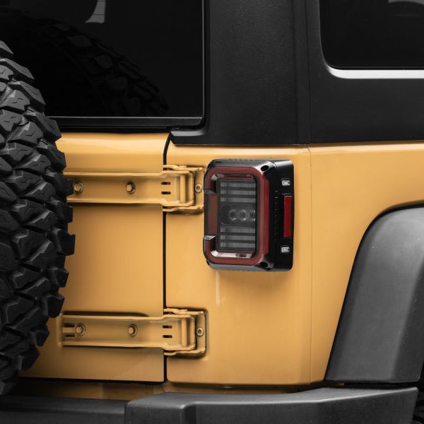 Raxiom J138358 - RAXJ138358 - Raxiom 07-18 Jeep Wrangler JK Axial Series LED Halo Tail Lights- Black Housing (Dark Smoked Lens) - Shipped in Europe - Tuningsupply.com