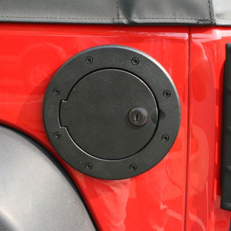 Rugged Ridge 11425.06 - RUG11425.06 - Rugged Ridge Locking Gas Cap Door Black Alum 07-18 Jeep Wrangler JK - Shipped in Europe - Tuningsupply.com