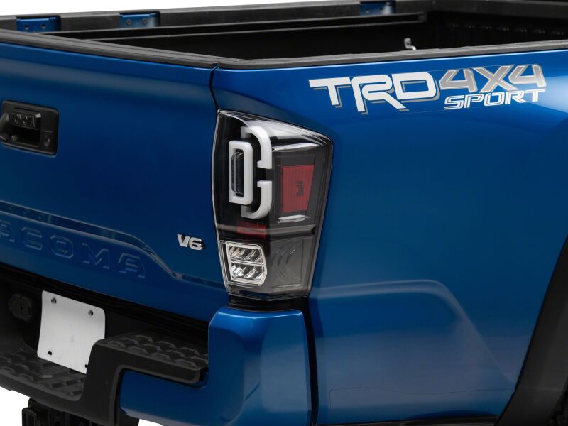 

Raxiom TT30331 - RAXTT30331 - Raxiom 16-23 Toyota Tacoma XW Series Sequential LED Tail Lights- Black Housing- Clear Lens - Shipped in Europe - Tuningsupply.com
