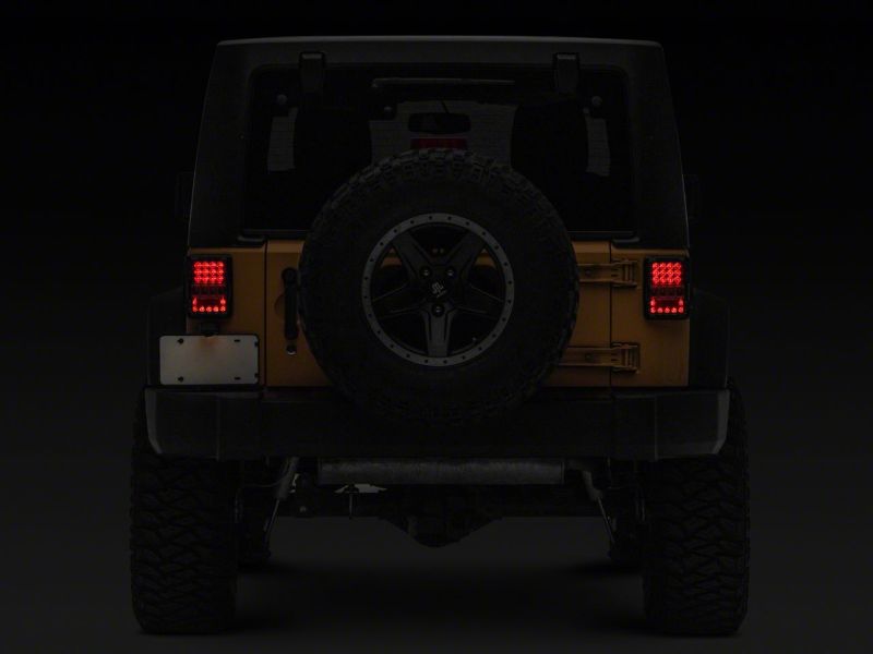 

Raxiom J141596 - RAXJ141596 - Raxiom 07-18 Jeep Wrangler JK Axial Series Lux LED Tail Lights- Black Housing (Clear Lens) - Shipped in Europe - Tuningsupply.com
