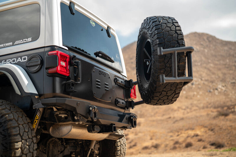 

DV8 Offroad TCJL-14 - DVETCJL-14 - DV8 18-25 Jeep Wrangler JL Body Mounted Tire Carrier - Shipped in Europe - Tuningsupply.com
