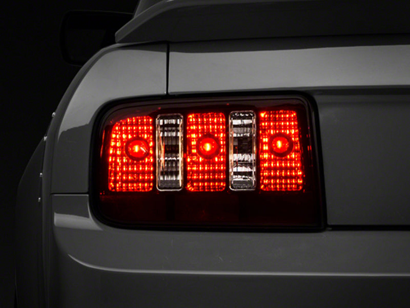 

Raxiom 49117 - RAX49117 - Raxiom 05-09 Ford Mustang Coyote Tail Lights- Black Housing (Smoked Lens) - Shipped in Europe - Tuningsupply.com
