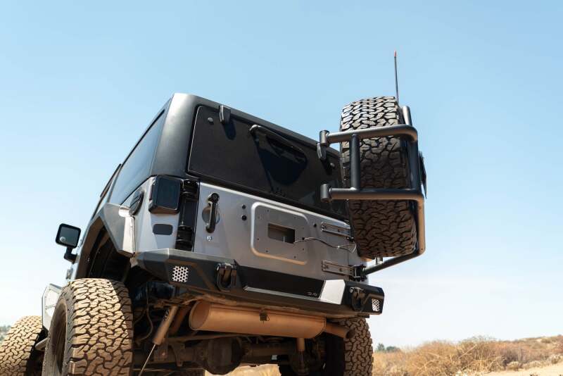 

DV8 Offroad TCJK-14 - DVETCJK-14 - DV8 07-18 Jeep Wrangler JK Body Mounted Tire Carrier - Shipped in Europe - Tuningsupply.com
