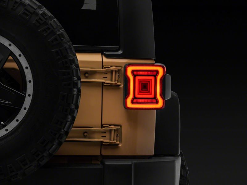 

Raxiom J164242 - RAXJ164242 - Raxiom 07-18 Jeep Wrangler JK Axial Series JL Style LED Tail Lights- Black Housing- Red Lens - Shipped in Europe - Tuningsupply.com
