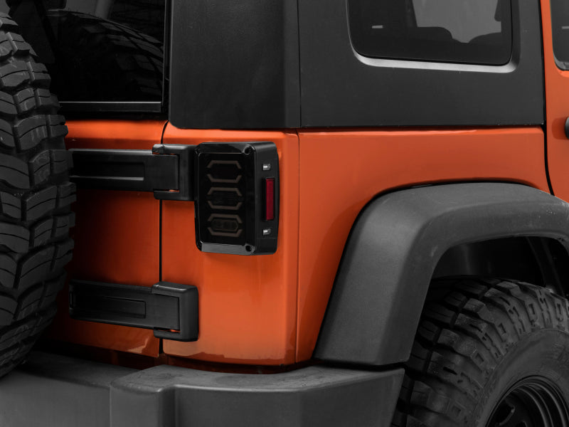 

Raxiom J106751 - RAXJ106751 - Raxiom 07-18 Jeep Wrangler JK LED Tail Lights- Black Housing (Smoked Lens) - Shipped in Europe - Tuningsupply.com

