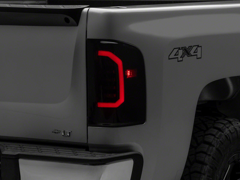 

Raxiom S150366 - RAXS150366 - Raxiom 07-14 Chevrolet Silverado 1500 Axial Series LED Tail Lights- Black Housing (Smoked Lens) - Shipped in Europe - Tuningsupply.com
