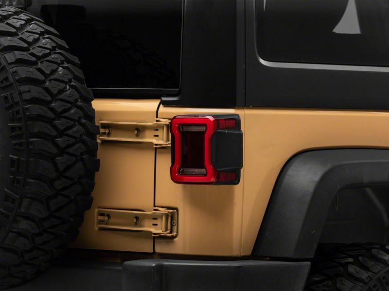 

Raxiom J164242 - RAXJ164242 - Raxiom 07-18 Jeep Wrangler JK Axial Series JL Style LED Tail Lights- Black Housing- Red Lens - Shipped in Europe - Tuningsupply.com
