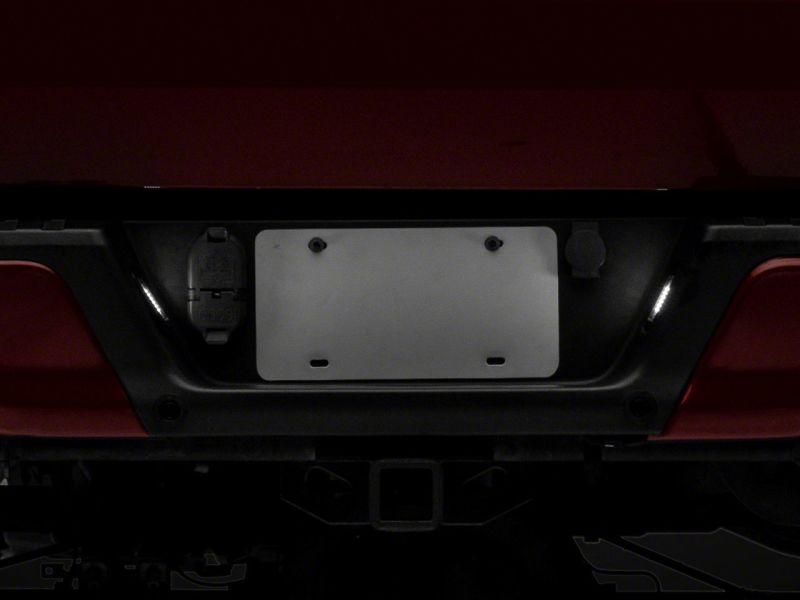 

Raxiom T549999 - RAXT549999 - Raxiom 07-14 Ford F-150 Axial Series LED License Plate Lamps- Smoked - Shipped in Europe - Tuningsupply.com

