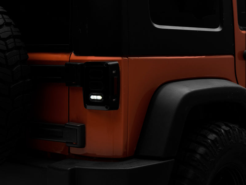 

Raxiom J106751 - RAXJ106751 - Raxiom 07-18 Jeep Wrangler JK LED Tail Lights- Black Housing (Smoked Lens) - Shipped in Europe - Tuningsupply.com
