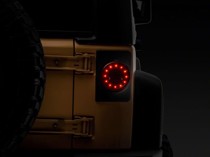 

Raxiom J164240 - RAXJ164240 - Raxiom 07-18 Jeep Wrangler JK Axial Series Halo LED Tail Lights- Black Housing (Clear Lens) - Shipped in Europe - Tuningsupply.com
