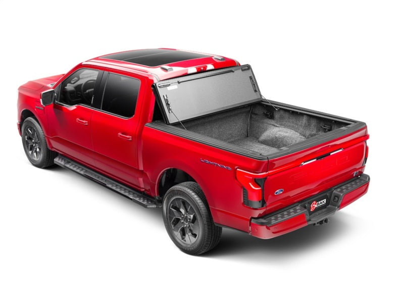 

BAK  - BAK448339 - BAK 21-22 Ford F-150 (Incl. 2022 Lightning) BAKFlip MX4 5.7ft Bed Cover - Matte Finish - Shipped in Europe - Tuningsupply.com
