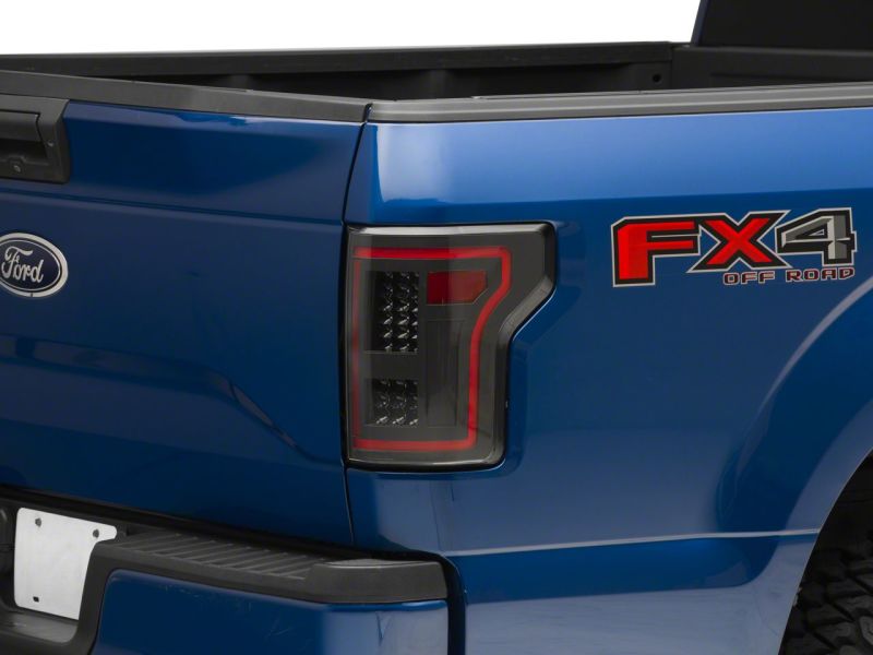 

Raxiom T544625 - RAXT544625 - Raxiom 15-17 Ford F-150 LED Tail Lights w/ SEQL Turn Signals- Black Housing (Clear Lens) - Shipped in Europe - Tuningsupply.com
