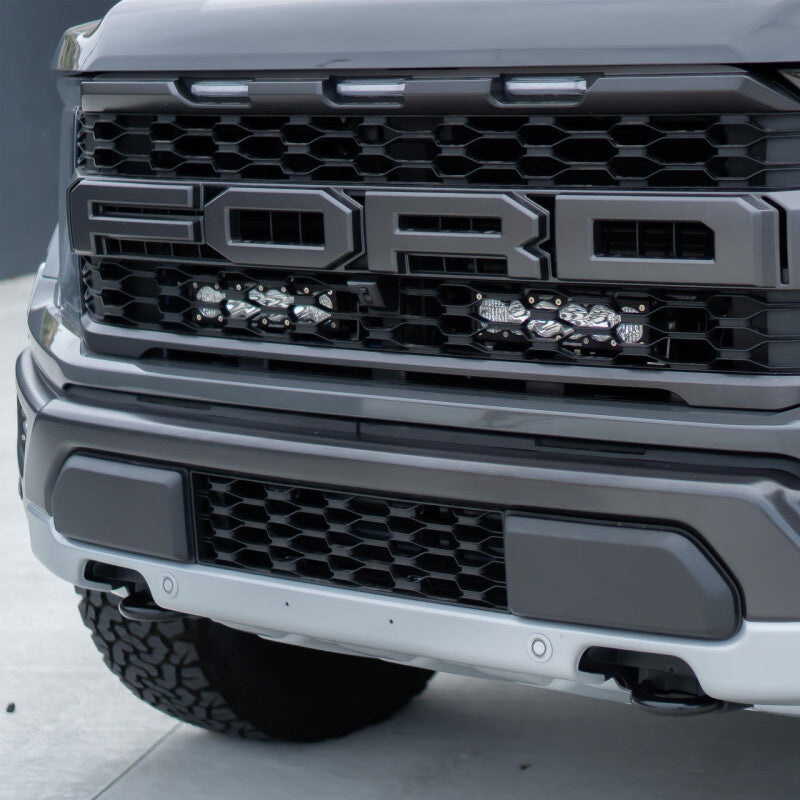 

Baja Designs 448064 - BAJ448064 - Baja Designs 2021+ Ford Raptor OnX6 Behind Grill Kit -10in. Amber D/C - Shipped in Europe - Tuningsupply.com
