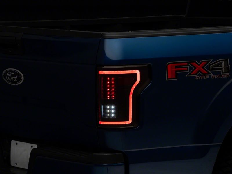 

Raxiom T544625 - RAXT544625 - Raxiom 15-17 Ford F-150 LED Tail Lights w/ SEQL Turn Signals- Black Housing (Clear Lens) - Shipped in Europe - Tuningsupply.com

