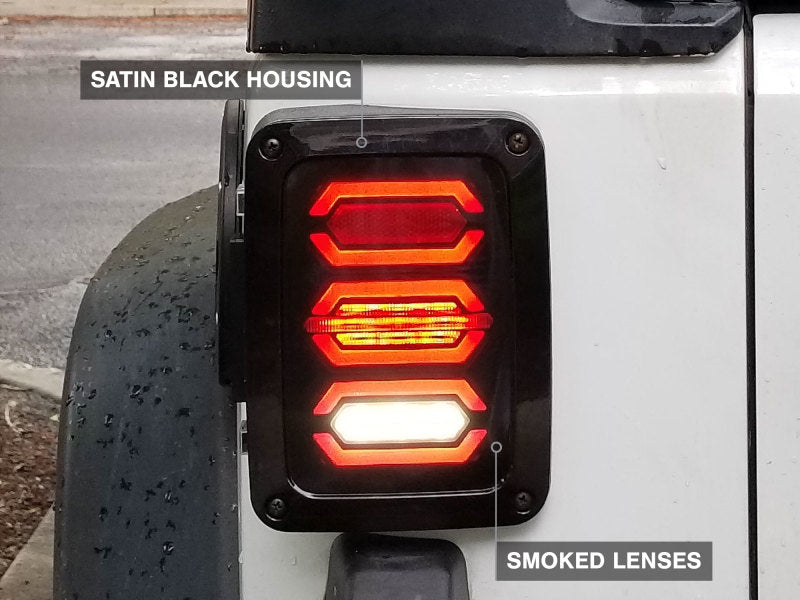 

Raxiom J106751 - RAXJ106751 - Raxiom 07-18 Jeep Wrangler JK LED Tail Lights- Black Housing (Smoked Lens) - Shipped in Europe - Tuningsupply.com
