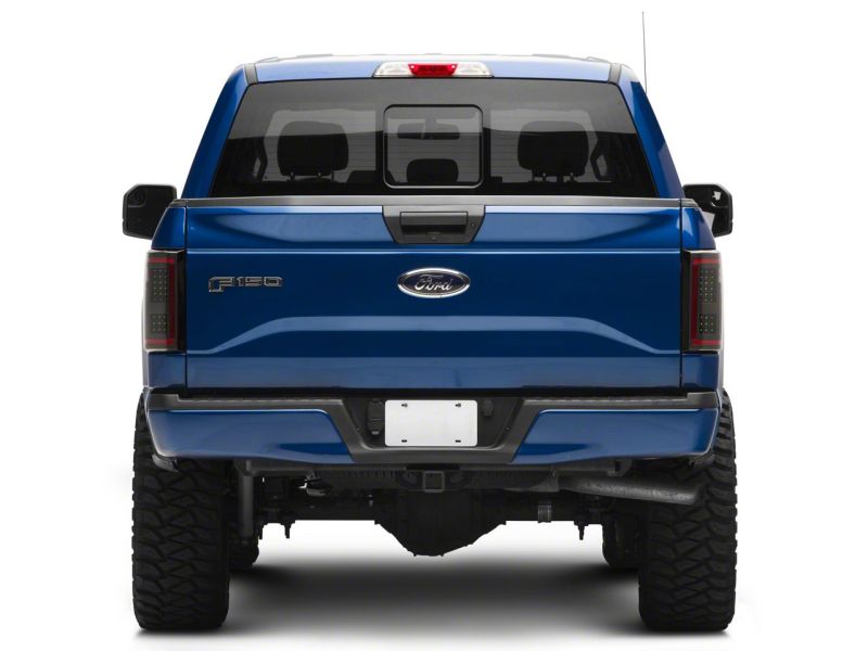

Raxiom T544625 - RAXT544625 - Raxiom 15-17 Ford F-150 LED Tail Lights w/ SEQL Turn Signals- Black Housing (Clear Lens) - Shipped in Europe - Tuningsupply.com
