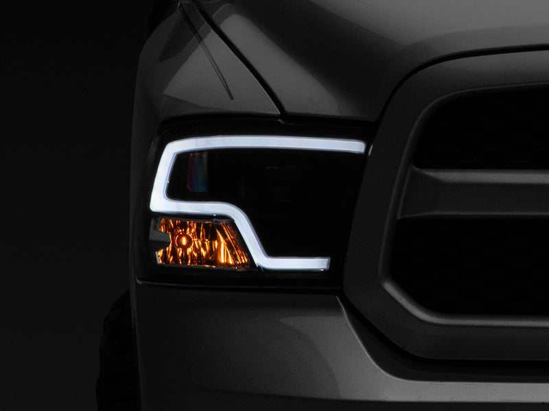 

Raxiom R111516 - RAXR111516 - Raxiom 09-18 RAM 1500 LED Halo Projector Headlights- Black Housing (Clear Lens) - Shipped in Europe - Tuningsupply.com
