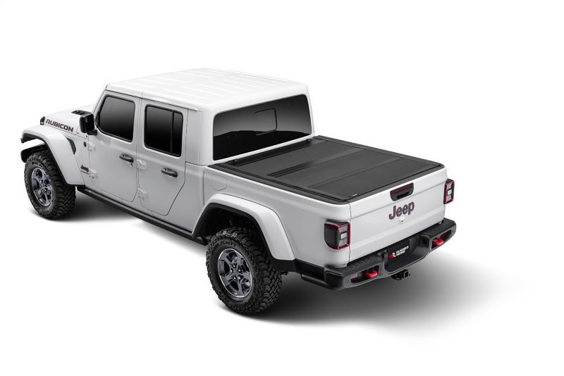 

Rugged Ridge 13550.24 - RUG13550.24 - Rugged Ridge Armis Hard Folding With LINE-X Bed Cover 2020 JT - Shipped in Europe - Tuningsupply.com
