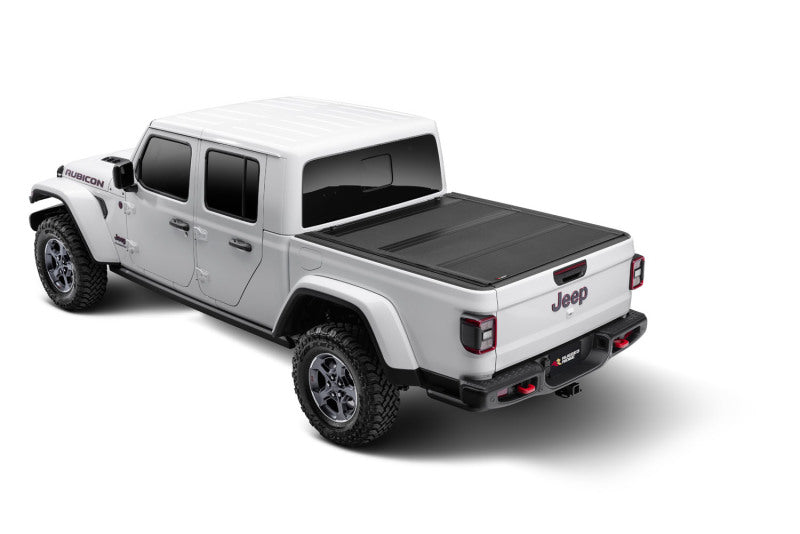 

Rugged Ridge 13550.24 - RUG13550.24 - Rugged Ridge Armis Hard Folding With LINE-X Bed Cover 2020 JT - Shipped in Europe - Tuningsupply.com
