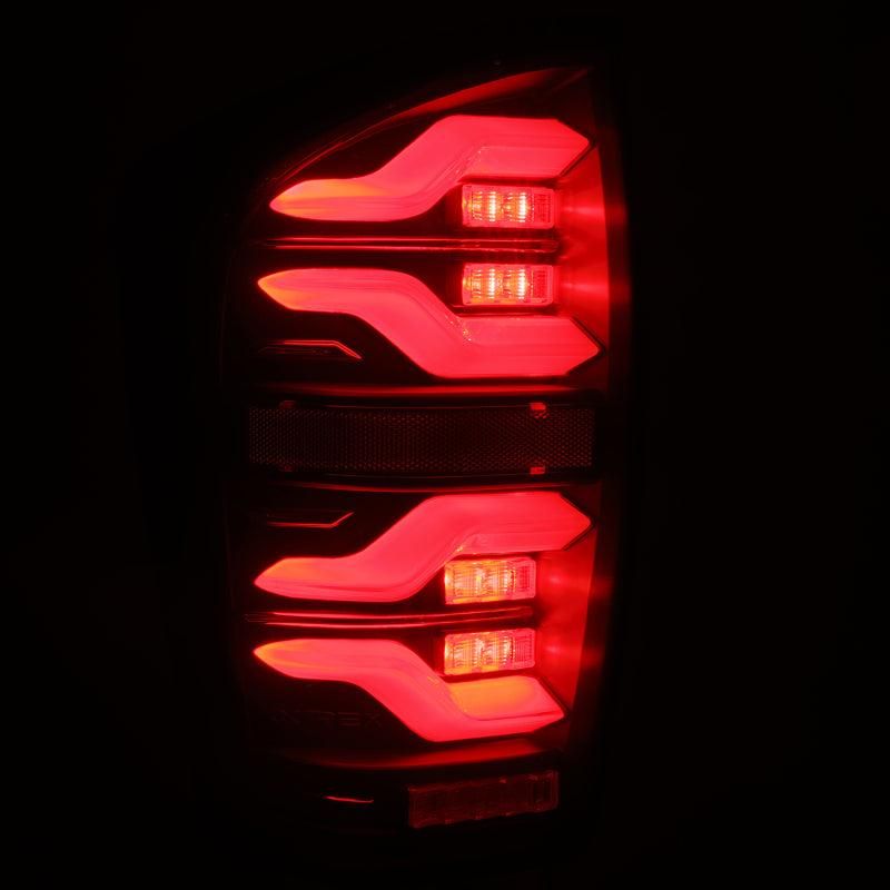 AlphaRex 16-21 Toyota TacomaLUXX LED Taillights Blk w/Activ Light/Seq Signal-tuningsupply.com