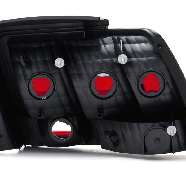 Raxiom 99-04 Ford Mustang Excluding 99-01 Cobra Tail Lights- Black Housing (Smoked Lens) - SMINKpower Performance Parts RAX49080 Raxiom