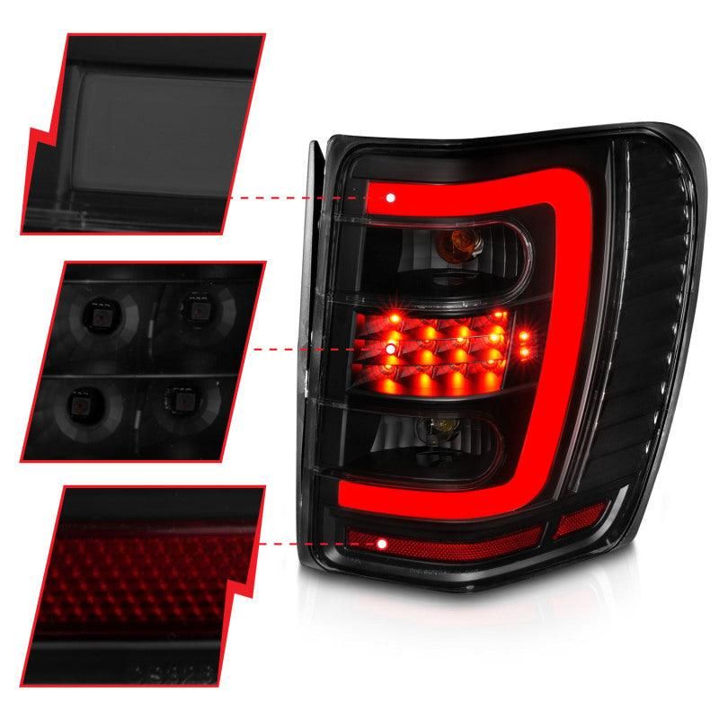 ANZO 1999-2004 Jeep Grand Cherokee LED Tail Lights w/ Light Bar Black Housing Smoke Lens-tuningsupply.com