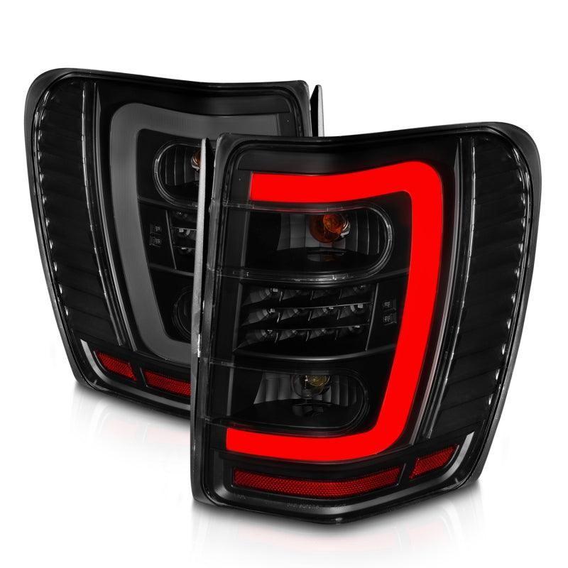 ANZO 1999-2004 Jeep Grand Cherokee LED Tail Lights w/ Light Bar Black Housing Smoke Lens-tuningsupply.com